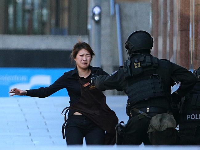 The emotion and relief was evident as the hostage met police. Picture: AP Photo/Rob Griffith