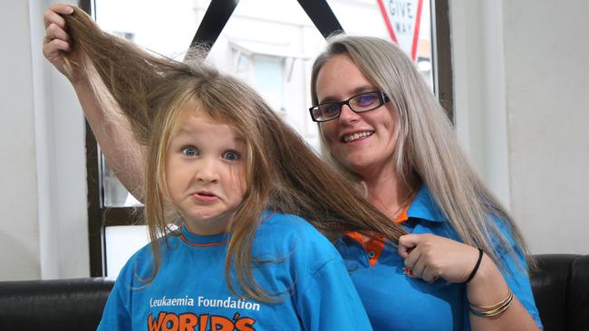 Cooper Pamment, 6, with his mum Kylie before his hair was cut. Picture: Robert Pozo