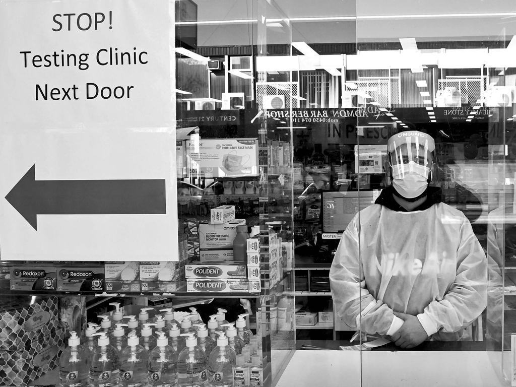 FACES OF LOCKDOWN: Un-named pharmacy worker poses for a photograph. (didn't want his name to be used ) Working behind screening in Fairfield. Photo: Jeremy Piper