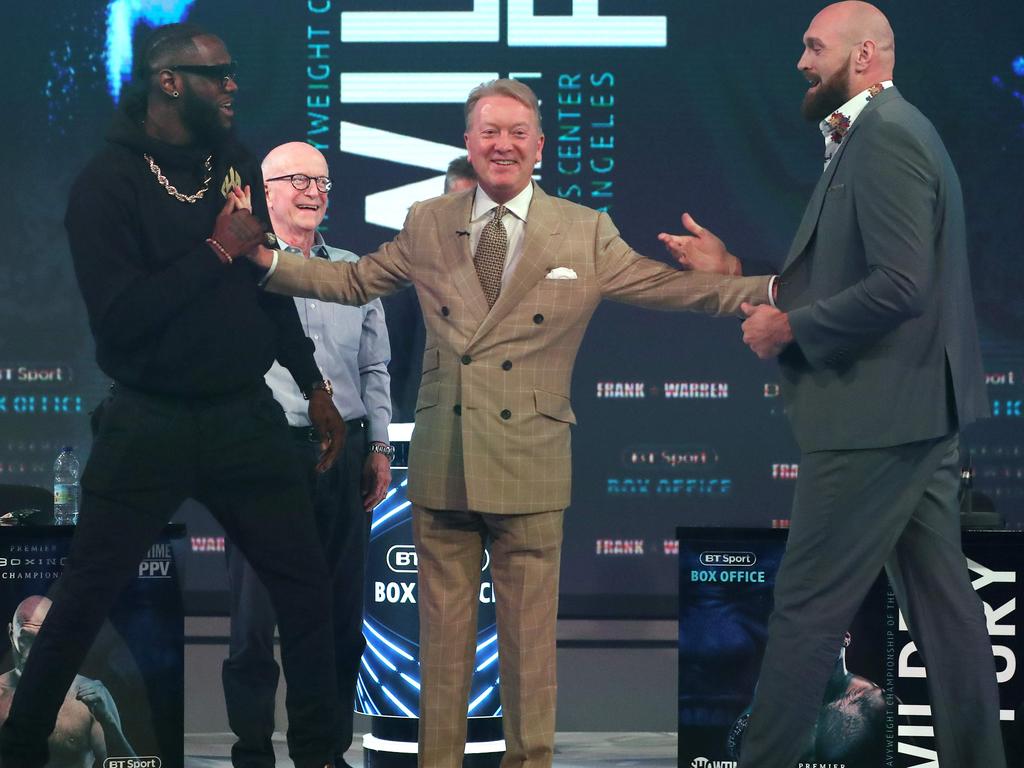 Deontay Wilder and former world heavyweight champion Tyson Fury are separated by boxing promoter and manager Frank Warren. 