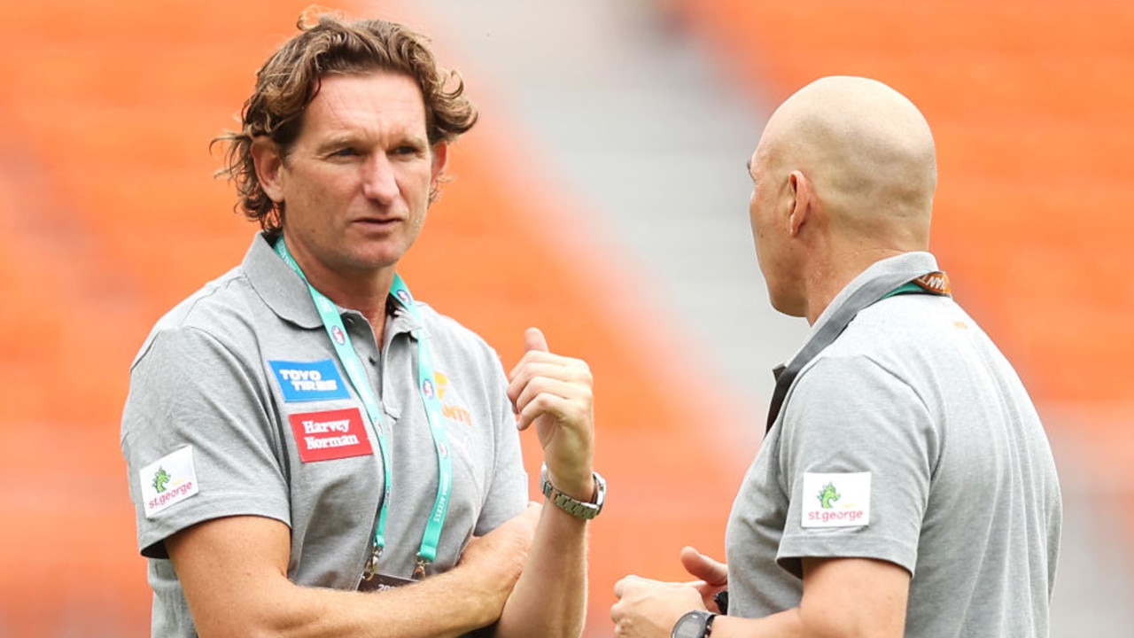 SYDNEY, AUSTRALIA - MARCH 06: Giants leadership advisor James Hird speaks to other members of staff on field before the AFL AAMI Community Series match between the Greater Western Sydney Giants and the Collingwood Magpies at GIANTS Stadium on March 06, 2022 in Sydney, Australia. (Photo by Mark Kolbe/Getty Images)