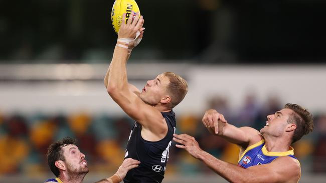 Harry McKay of the Blues marks between two Lions defenders. Picture: Michael Klein