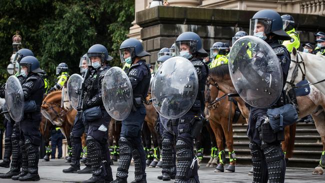 Police facing off with anti-vaccine protesters in Melbourne last month. Picture: Darrian Traynor