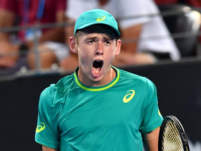 Alex de Minaur of Australia celebrates winning a point during his first round match against Steve Johnson of the USA at the Brisbane International Tennis Tournament in Brisbane, Sunday, December 31, 2017. (AAP Image/Darren England) NO ARCHIVING, EDITORIAL USE ONLY