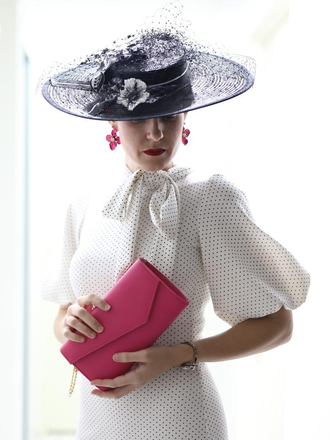 Raceway fashion has moved online with Andergrove resident Anna Dutton taking part in the Virtual Fashions Off The Field competition. Ms Dutton wore a black and white outfit she had created and her hat was made by Crazy Tea Pot.