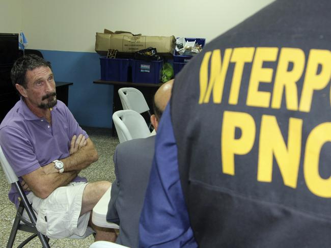 John McAfee is questioned by police in Guatemala in 2012. Picture: Getty Images