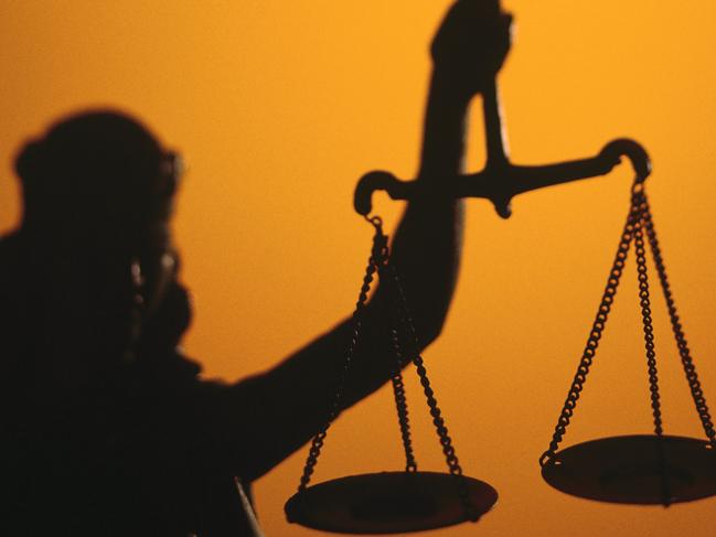 THINKSTOCK ONE TIME ONLY Silhouette of scales of Lady Justice holding scales