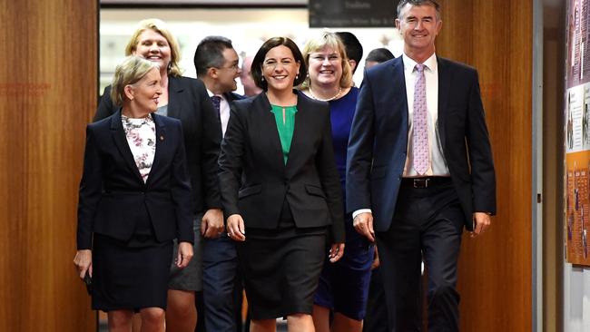 Queensland LNP leadership contender Deb Fracklington (centre), flanked by fellow party members Ros Bates (left) and Tim Mander, arrives at a party room meeting at Parliament House in Brisbane (AAP Image/Dan Peled) NO ARCHIVING