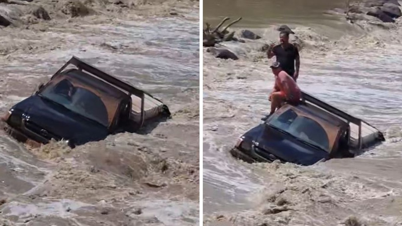 Rescue as ute stranded in croc-infested river