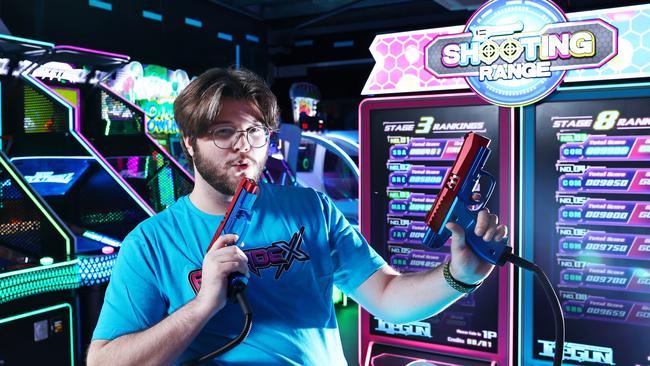 The Cairns northern beaches now has its very own video game arcade, after Arcade X opened at Smithfield. Arcade X assistant manager Kydan Sheppard plays Shooting Range, a next generation shooting game. Picture: Brendan Radke