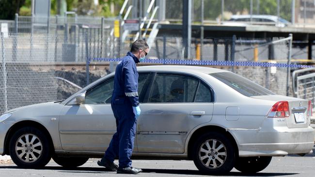 Police investigate the area around Keilor Plains railway station. Picture: Andrew Henshaw