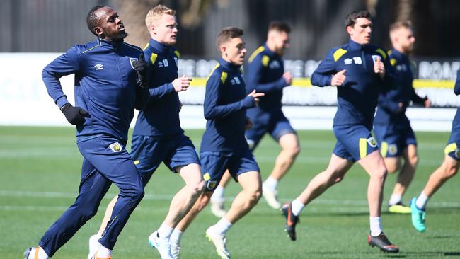 Usain Bolt strides out at Central Coast Mariners training on Tuesday. Picture: AAP