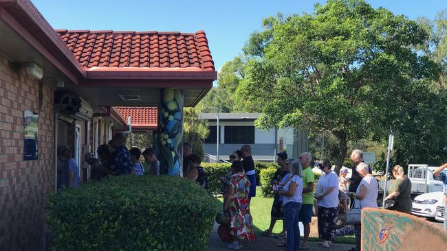 The line-up at Crestmead polling booth this morning where a fight broke out between the father of a Division 8 candidate and a woman handing out cards for mayoral candidate Darren Power