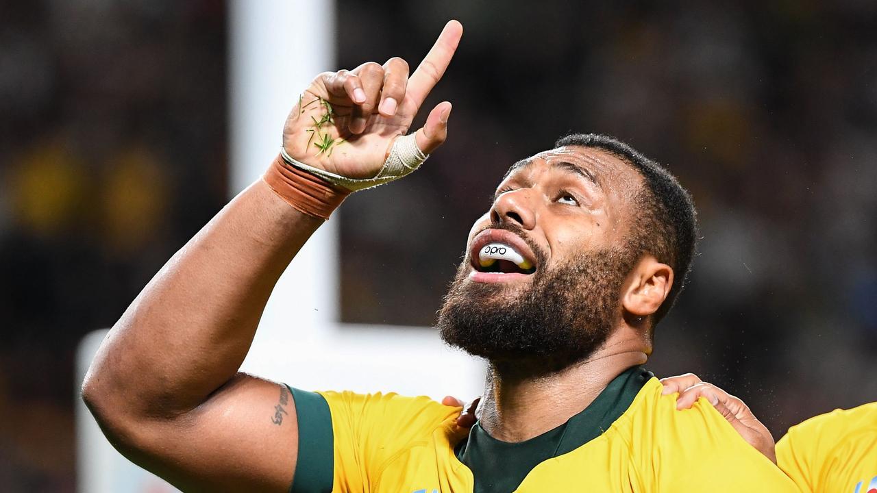 Australia centre Samu Kerevi celebrates scoring a try against Fiji.