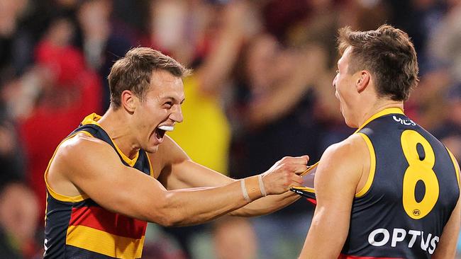 ADELAIDE, AUSTRALIA – MAY 22: Tom Doedee of the crows celebrates with Jake Kelly of the Crows after the final siren during the round 10 AFL match between the Adelaide Crows and the Melbourne Demons at Adelaide Oval on May 22, 2021 in Adelaide, Australia. (Photo by Daniel Kalisz/Getty Images)