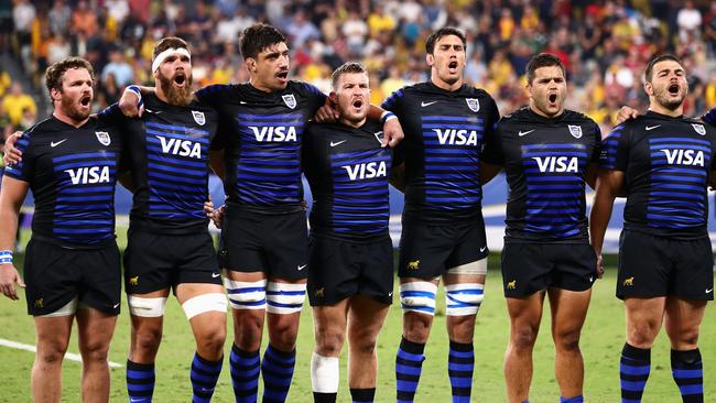 TOWNSVILLE, AUSTRALIA - SEPTEMBER 25: The Pumas line up for the Argentinian national anthem during The Rugby Championship match between the Australian Wallabies and Argentina Pumas at QCB Stadium on September 25, 2021 in Townsville, Australia. (Photo by Chris Hyde/Getty Images)