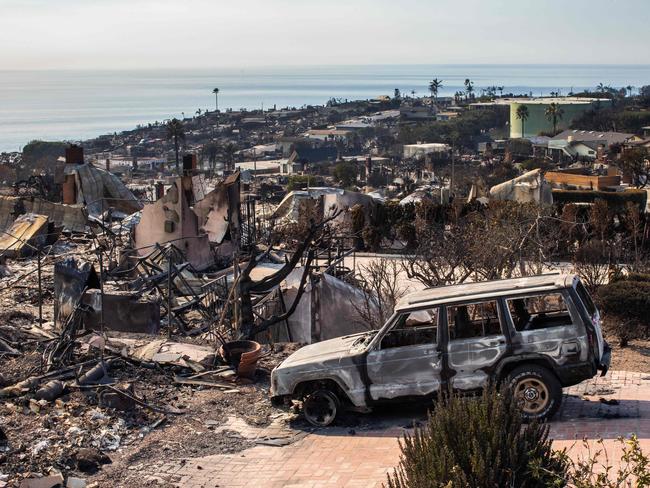 LOS ANGELES, CALIFORNIA - JANUARY 1-: Burned houses from the Palisades Fire are seen on January 10, 2025 in the Pacific Palisades neighborhood of Los Angeles, California. Multiple wildfires fueled by intense Santa Ana winds are burning across Los Angeles County. Reportedly at least 10 people have died. Over 9,000 structures have been damaged or burned while the fires have spread to more than 36,000 acres   Apu Gomes/Getty Images/AFP (Photo by Apu Gomes / GETTY IMAGES NORTH AMERICA / Getty Images via AFP)