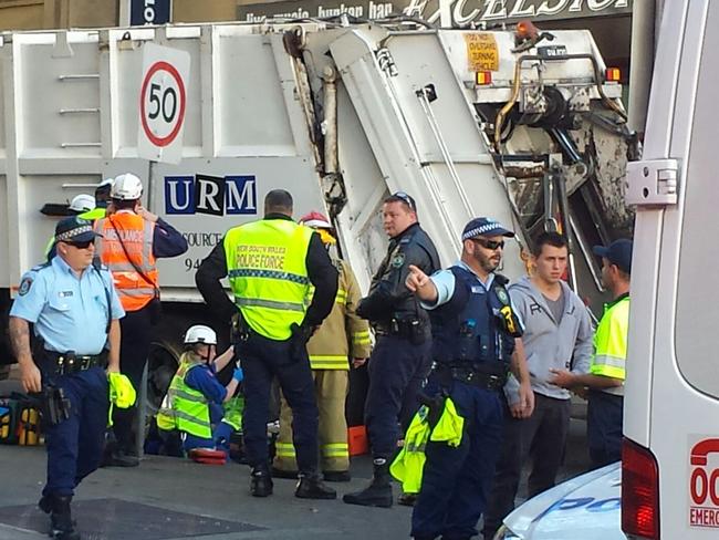 EMERGENCY services have freed a man trapped under a garbage truck in Surry Hills. Picture: Ben McClellan
