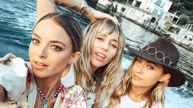 Kaitlynn Carter (left) was seen kissing Miley Cyrus (centre) while on holiday in Italy, a day after Miley announced her separation from husband Liam Hemsworth. Pictured with Brandi Cyrus (right). Source — https://www.instagram.com/brandicyrus/