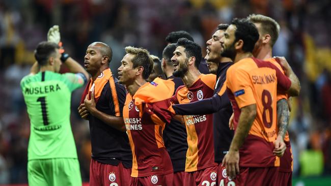 Galatasaray's players celebrate after winning big against Lokomotiv Moscow. Picture: AFP