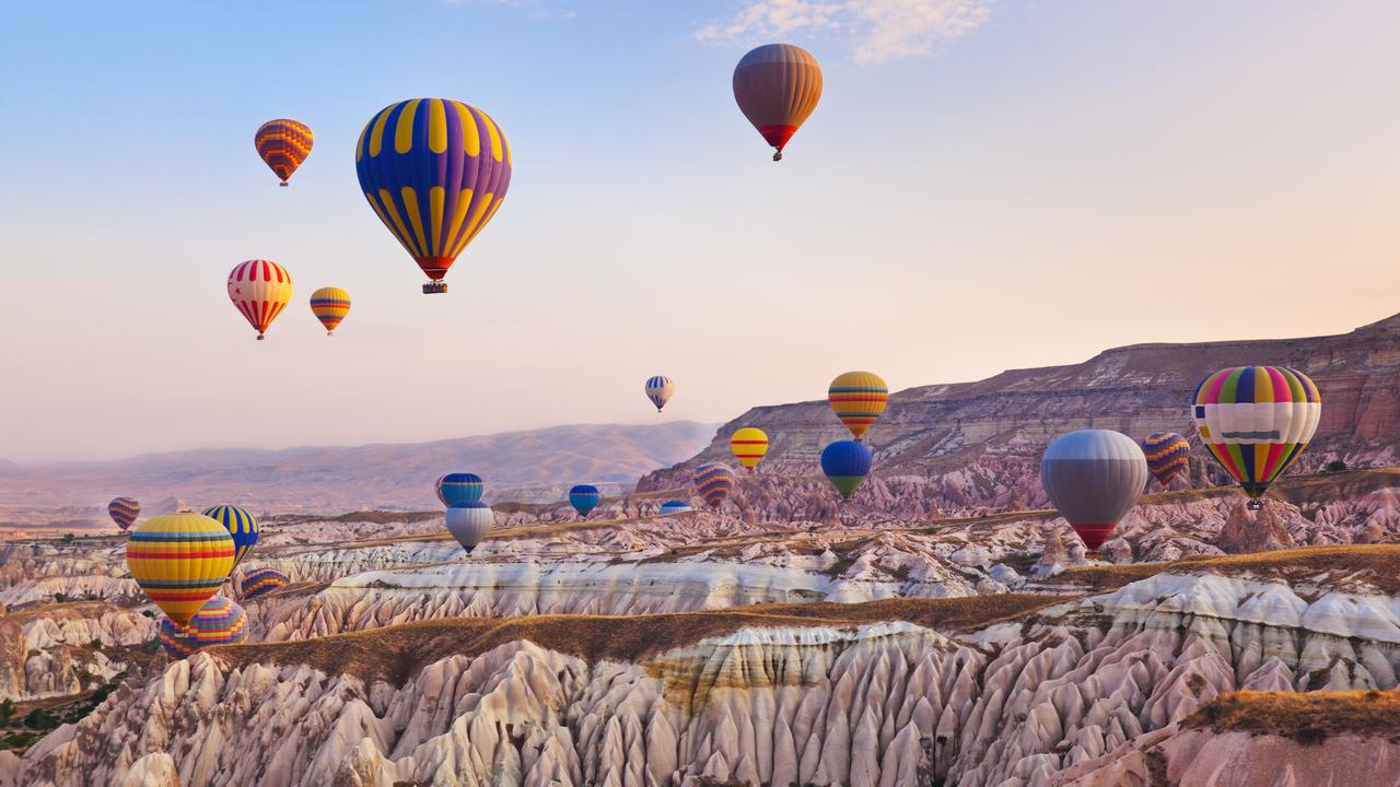 The stunning scene at Turkey's Cappadocia as hot air balloons fill the sky.