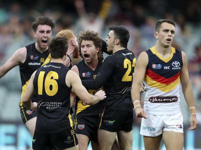 SANFL - PRELIMINARY FINAL - Glenelg v Adelaide Crows at Adelaide Oval. Matthew Snook celebrates his goal as Lachlan Scholl walks off Picture SARAH REED