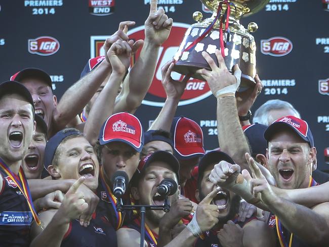 21/9/14 SANFL Grand Final between the Port Adelaide Magpies and the Norwood Redlegs held at the Adelaide Oval. Redlegs players celebrate victory.