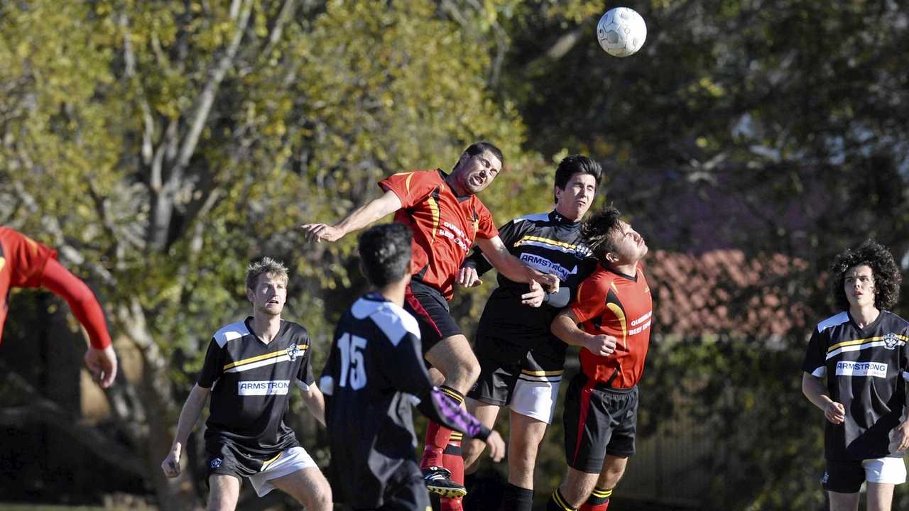 TIGHT TUSSLE: Gatton's Austin Lenord (left) and Oliver Wacker (right) contest the ball with West Wanderers player Mitchell Albury. Gatton won the Premier Men's match 3-1. Picture: Kevin Farmer