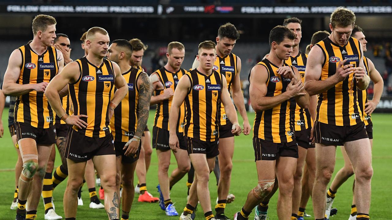 MELBOURNE, AUSTRALIA - APRIL 18: The Hawks look dejected after losing the round five AFL match between the Hawthorn Hawks and the Melbourne Demons at Melbourne Cricket Ground on April 18, 2021 in Melbourne, Australia. (Photo by Quinn Rooney/Getty Images)