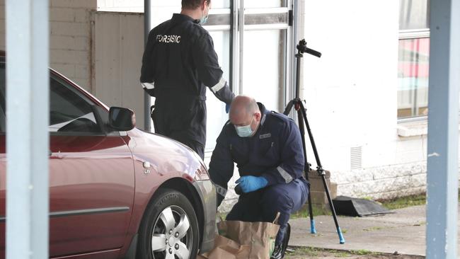 Police outide a Dandenong North home where a newborn baby was left fighting for life. Picture: David Crosling