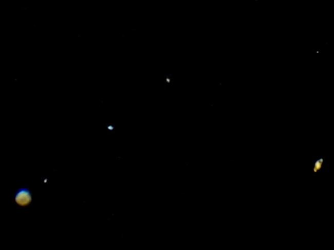 20/12/20 The Great Conjunction photographed on the 20/12/20 (due to predicted overcast conditions) with Jupiter and Saturn shown in the same frame. Also shown are Jupiter's Galilean moons and possibly Saturn's largest moon Titan also shown. Aaron Francis/The Australian