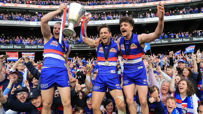 Jake Stringer, Luke Dahlhaus and Tom Liberatore with the cup. Picture: Alex Coppel