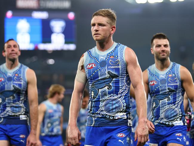 MELBOURNE, AUSTRALIA - MAY 21: Jack Ziebell of the Kangaroos (C) looks dejected following the round 10 AFL match between the North Melbourne Kangaroos and the Melbourne Demons at Marvel Stadium on May 21, 2022 in Melbourne, Australia. (Photo by Graham Denholm/Getty Images)