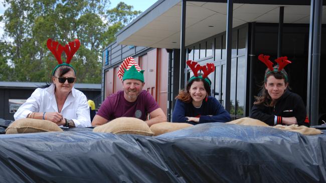 1924 Riverside Steakhouse staff Lisa Hay, manager Damien O'Riley, Cailyn Sutcliffe and Corey Iredale catch up to finalise preparations as the business closed on Sunday, December 11 ahead of peak River Murray flows. Picture: Dylan Hogarth