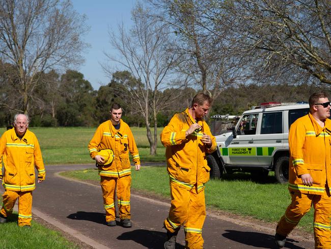 Firefighters take a break after fighting a fire in Jells Park, Wheeler's Hill. Picture: Sarah Matray