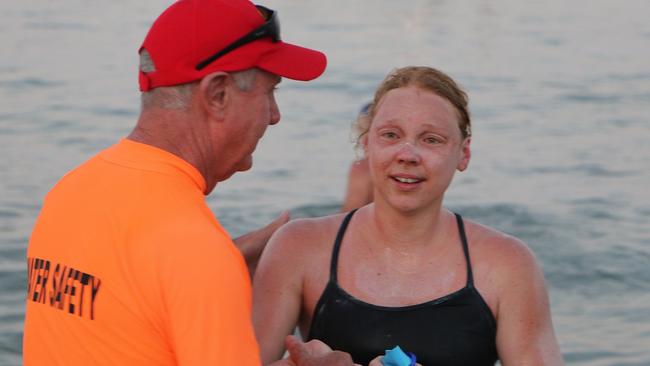 Exhausted marathon swimmer Harriet Grant arrives at Yorkeys Knob after swimming 35km from Green Island to the mainland. Picture: Nicole Gibson