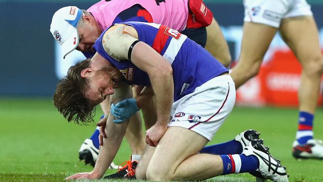 Roughead in pain after copping a ball to the eye. Picture: Getty Images