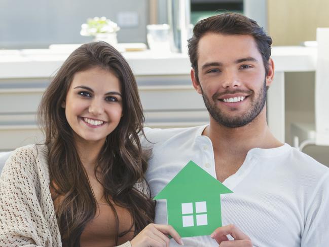 A young couple who have bought their first home and have a mortgage. They are working hard to pay down their home loan. Picture: iStock.