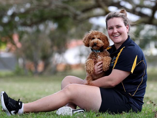 Capt Emma Kadziolka, with puppy Barney, is an army nurse with a brain tumour who will be heading to the Invictus Games in Sydney. Picture: Tara Croser.