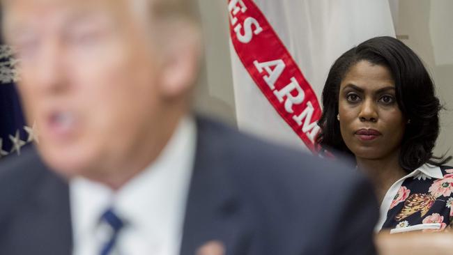 This photo taken on February 14, 2017 shows Omarosa Manigault, former White House Director of Communications for the Office of Public Liaison, sitting behind US President Donald Trump.