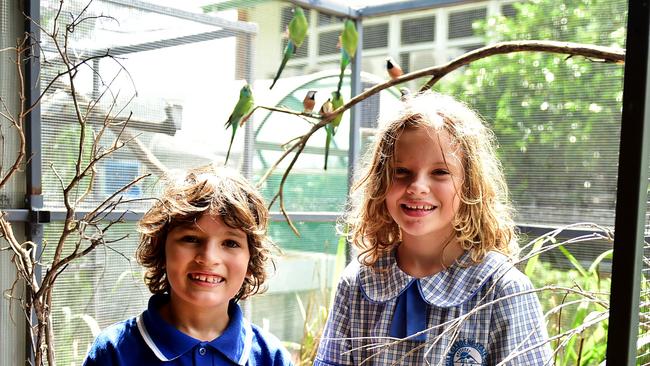 Belgian Gardens State School students Raehael Eusebe 9 and Neradah Duncan 9, in their community wildlife conservation award-winning aviary.