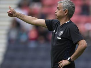 Manchester United's Portuguese manager Jose Mourinho gestures during the pre-season friendly football match between Wigan Athletic and Manchester United at the DW stadium in Wigan, northwest England, on July 16, 2016. / AFP PHOTO / JON SUPER / RESTRICTED TO EDITORIAL USE. No use with unauthorized audio, video, data, fixture lists, club/league logos or 'live' services. Online in-match use limited to 75 images, no video emulation. No use in betting, games or single club/league/player publications. /