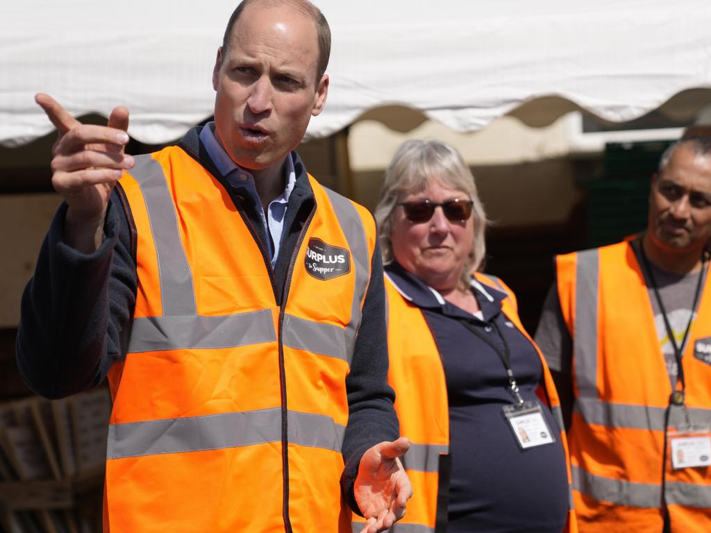 Prince William talks to van drivers who deliver the food for the charity. Picture: Getty Images