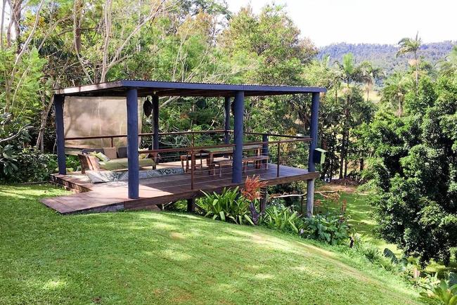 This covered deck is perfect for alfresco dining or afternoon drinks enjoying the view. Picture: Airbnb