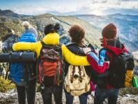 Group of people standing on the top of the mountain - Happy friends with backpacks having trekking weekend together - Sport, travel and hike concept