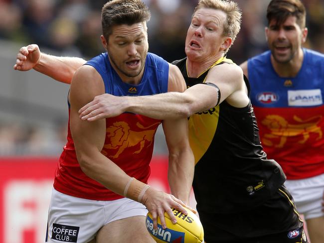 MELBOURNE, AUSTRALIA - AUGUST 25: Jack Riewoldt of the Tigers tackles Stefan Martin of the Lions during the round 23 AFL match between the Richmond Tigers and the Brisbane Lions at Melbourne Cricket Ground on August 25, 2019 in Melbourne, Australia. (Photo by Darrian Traynor/Getty Images)