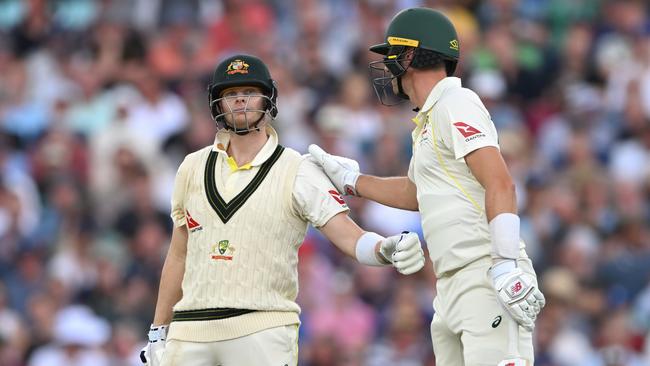 Australia batsman Steve Smith is congratulated after reaching his half century during day two of the 5th Test Match between England and Australia. Picture: Getty Images