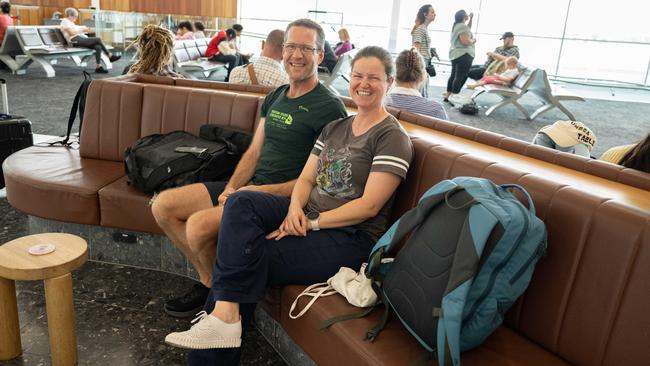 Chris Jacobson and Louise Morton, from Hobart, waiting for a delayed flight at Adelaide Airport on Monday. Picture: Morgan Sette