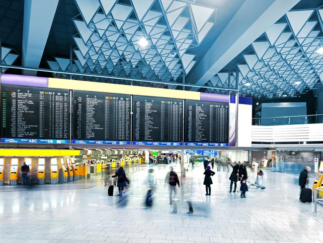 Airport Departure Board over the check-in counters