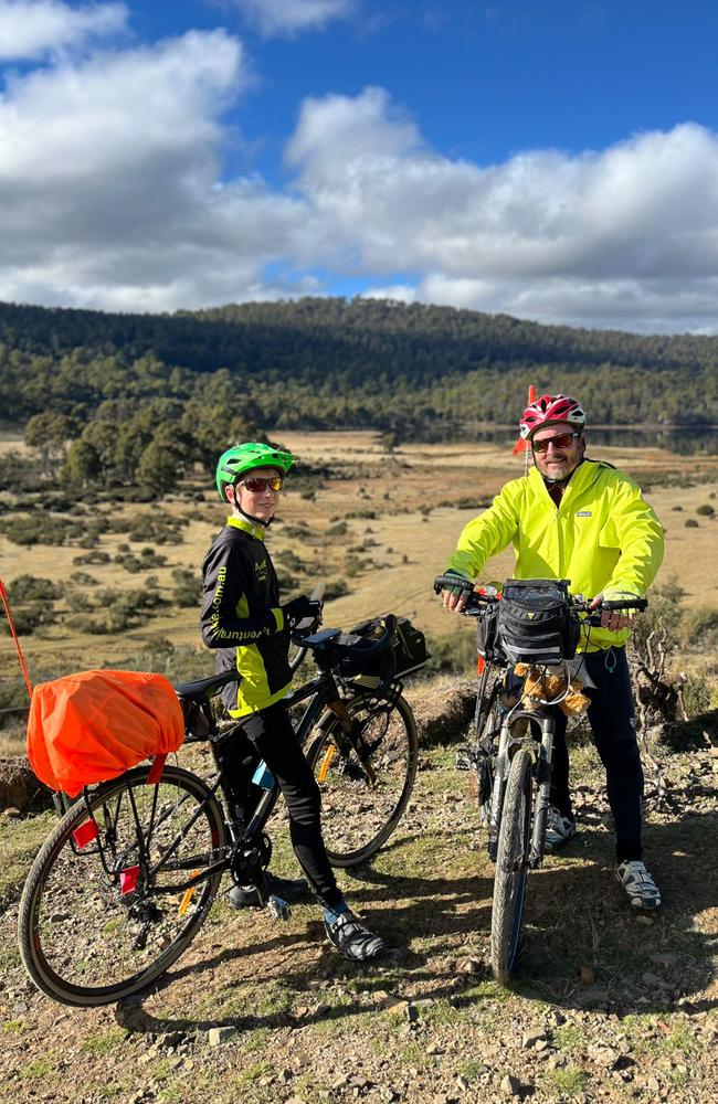 Phil and Ned at Pine Tier Lagoon in Tasmania. Phil Wise with son Ned 14 cycled from Hobart to Darwin. Picture: supplied